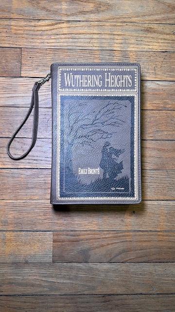 Book-shaped clutch with 'Wuthering Heights' on a wooden surface