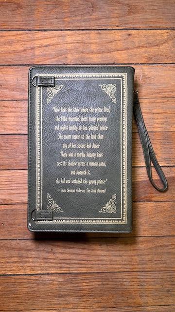 Black cover of wuthering heights with famous quote created as a storybook handbag on a wooden surface