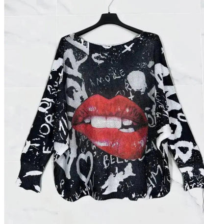 Black graphic sweater with large red lips and white collage lettering