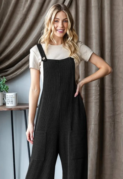 model showcasing the black ribbed jumpsuit