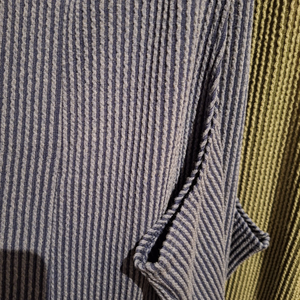 closeup of the fabric in the ribbed jumpsuit. 