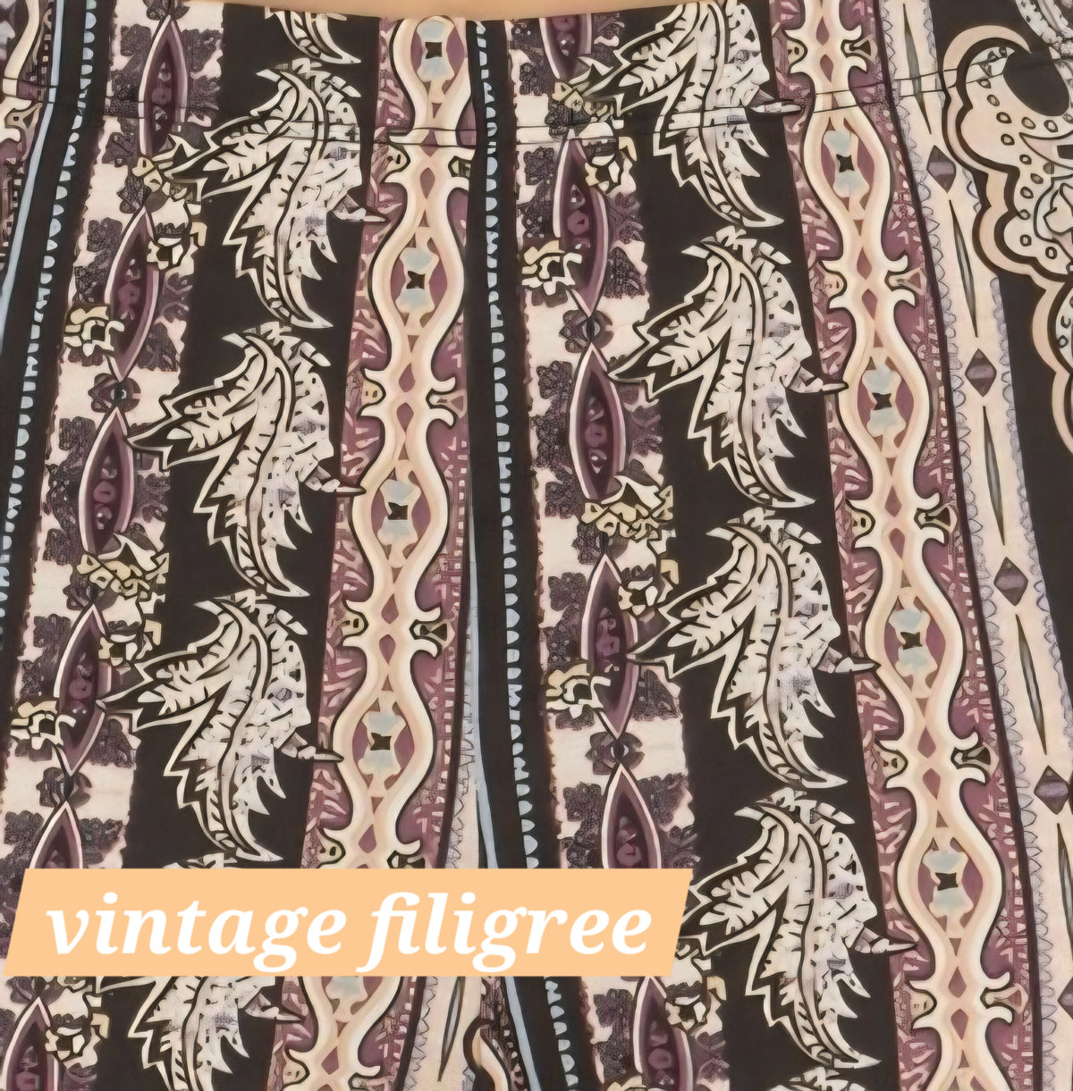 Vintage filigree flare leggings with black, cream, and muted purple motifs