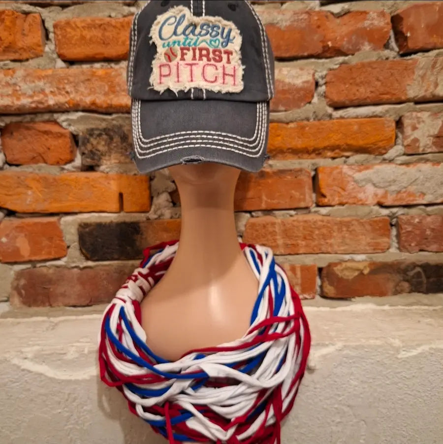 Mannequin wearing a red, white, and blue scarf with a cap labeled 'Classy until First Pitch' against a brick wall. Perfect for the 250th Anniversary of America and all the Phillies game