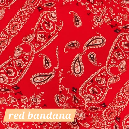 Red bandana print flare leggings with paisley pattern throughout