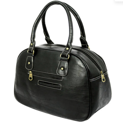 Black handbag with gold accents on a white background