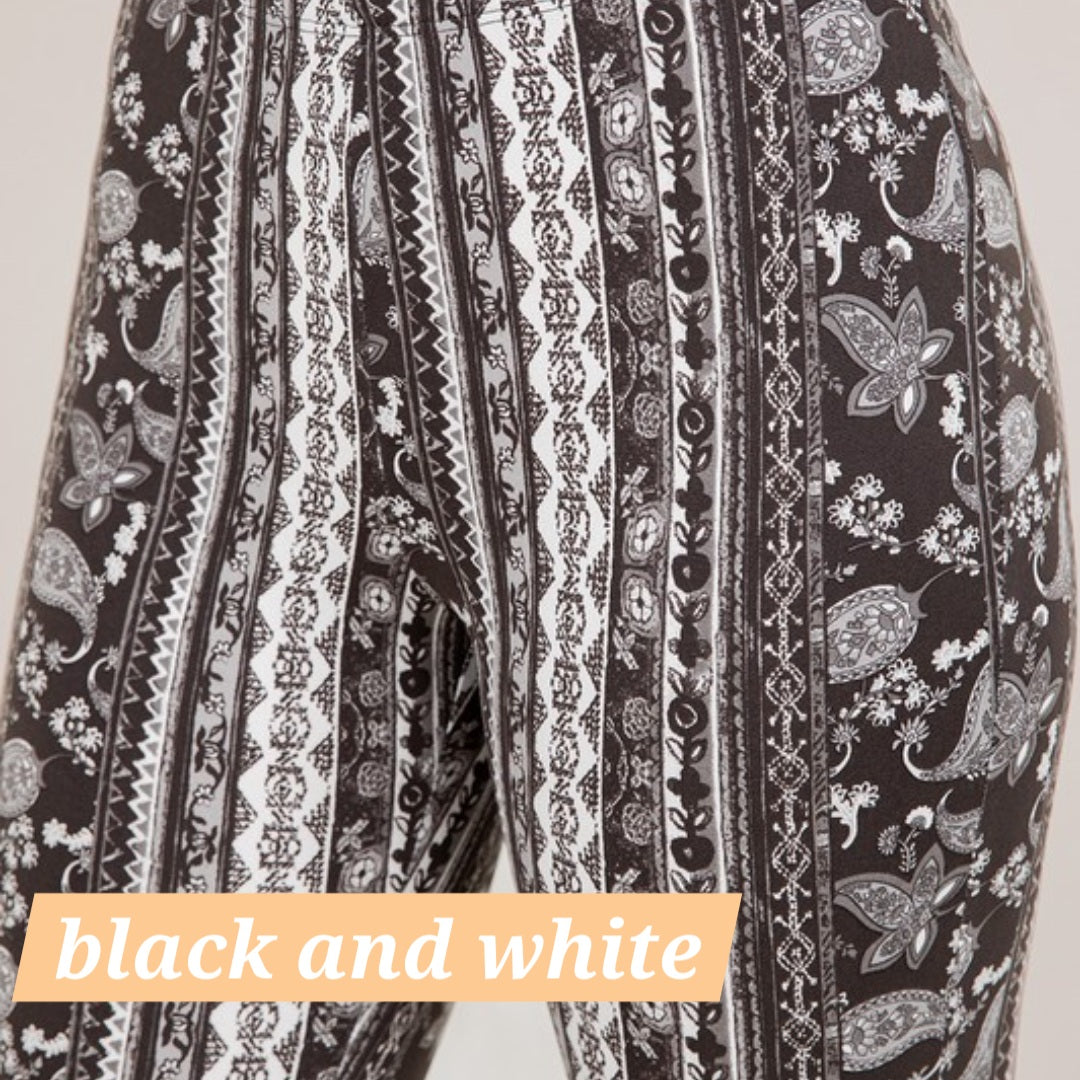 Black and white paisley filigree flare leggings with vertical stripe detailing
