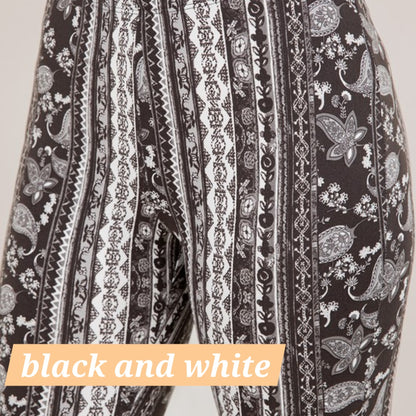 Black and white paisley filigree flare leggings with vertical stripe detailing