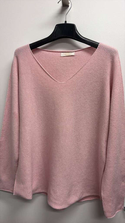 Mauve V-neck knit sweater on hanger with long sleeves