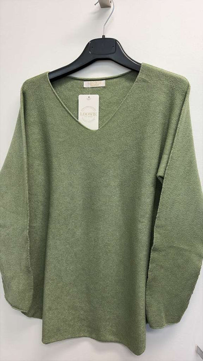 Green V-neck knit sweater on hanger with long sleeves