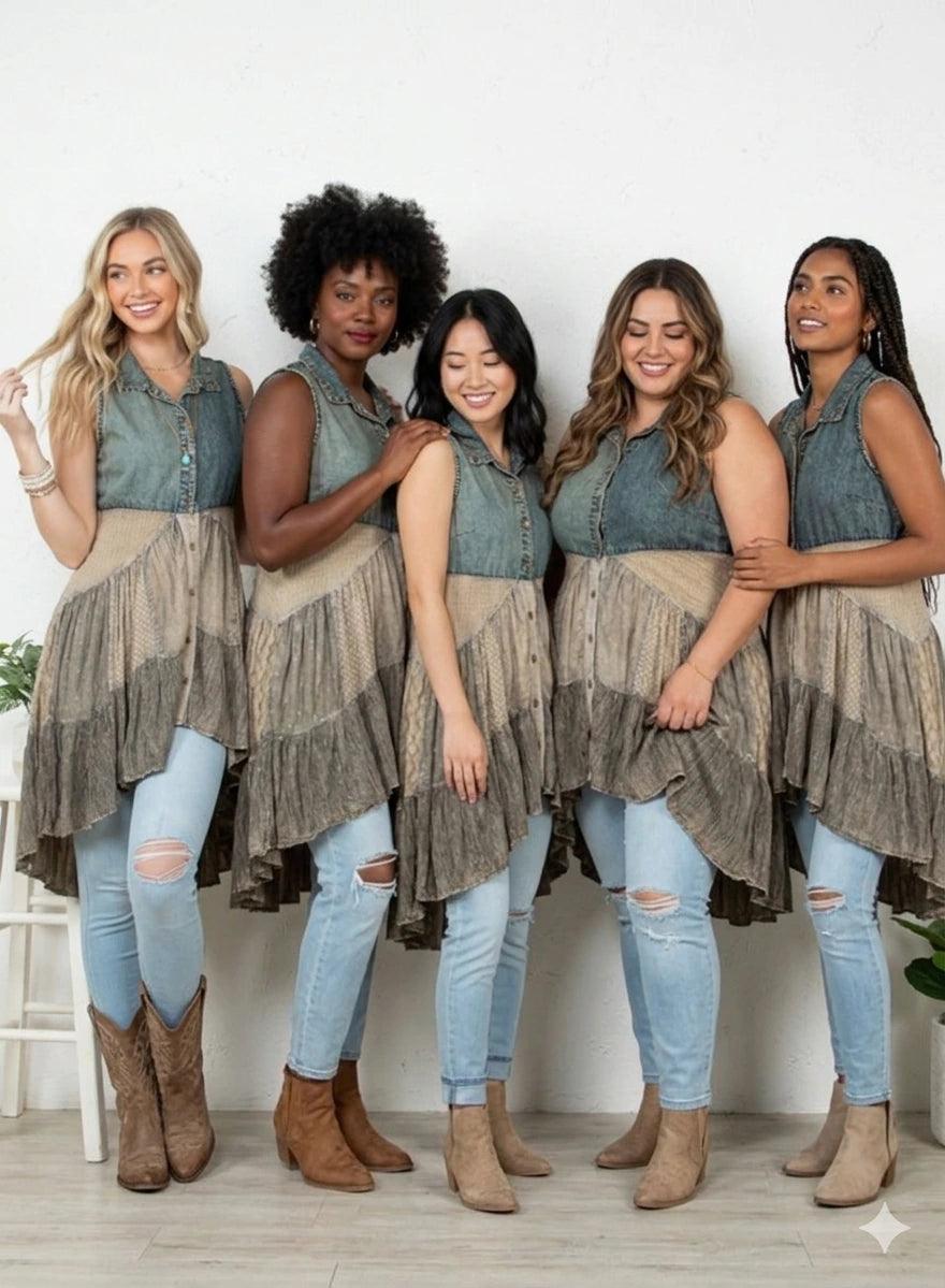 Five women wearing matching outfits  - a festival worthy tunic with denim tops and ruffled bottom, standing together.