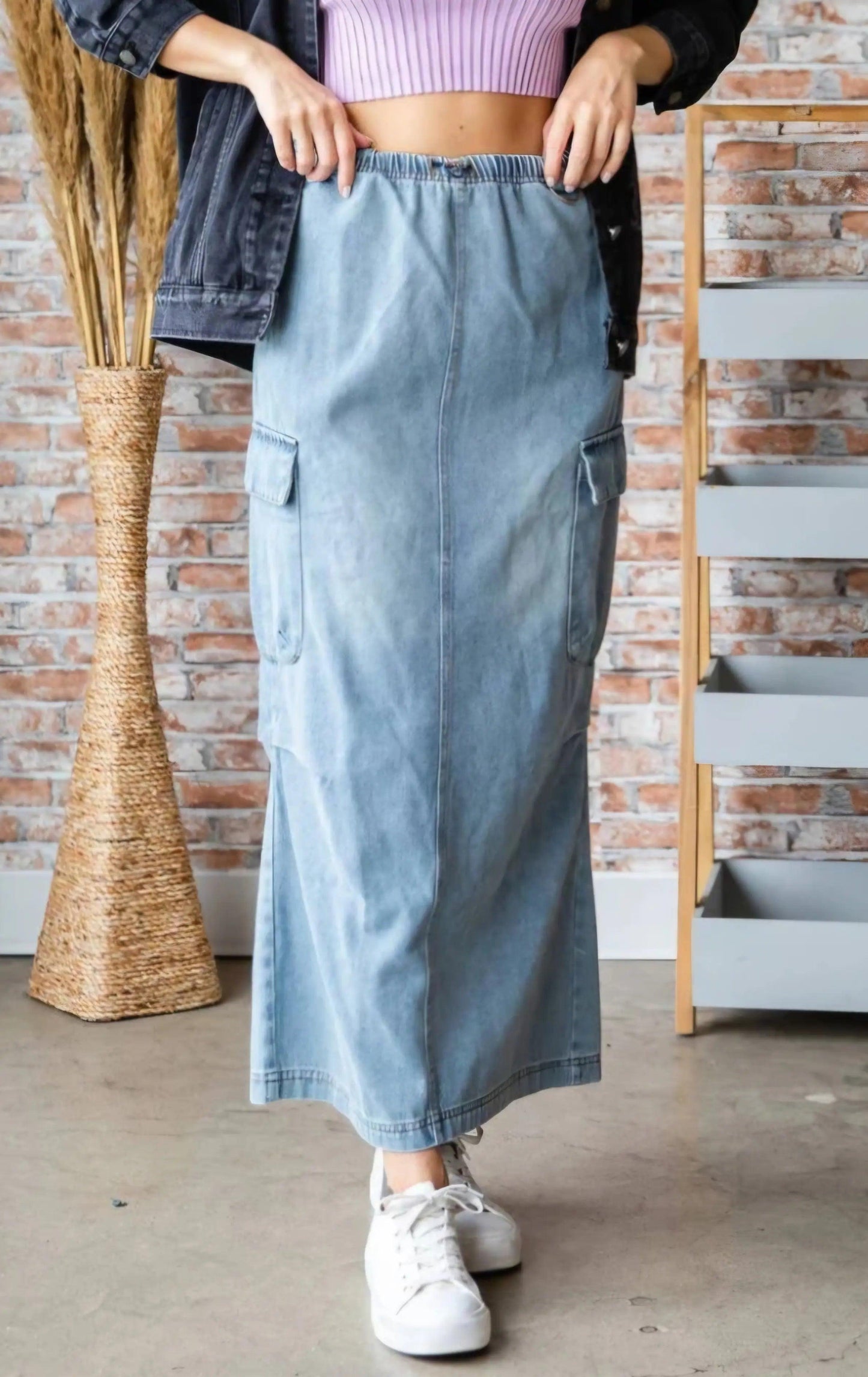 Close-up front view of denim cargo maxi skirt elastic waistband and cargo pockets styled with oversized denim jacket — quiet luxury boho aesthetic