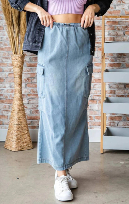 Close-up front view of denim cargo maxi skirt elastic waistband and cargo pockets styled with oversized denim jacket — quiet luxury boho aesthetic