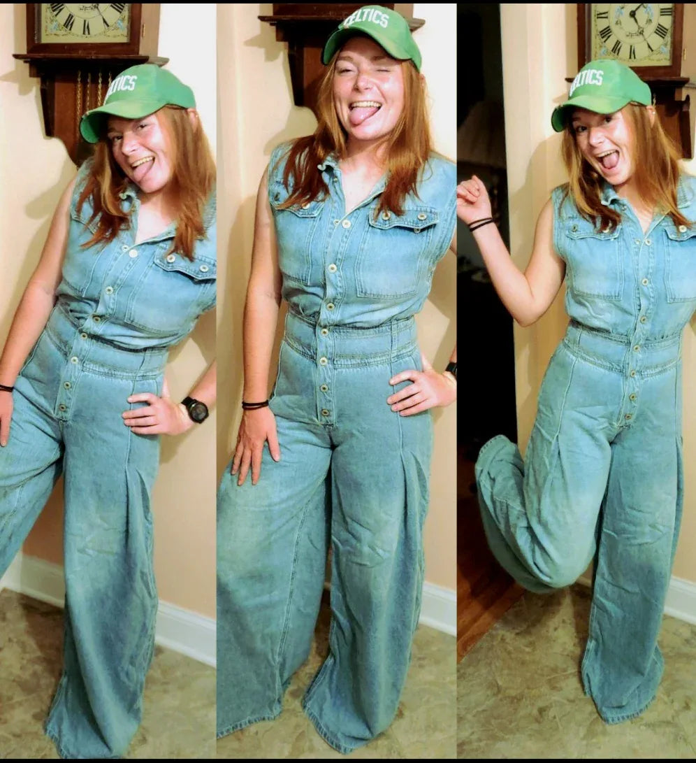Wide leg mechanic style denim jumpsuit with button front, cinched waist and barrel leg — boho street style OOTD styled with green cap